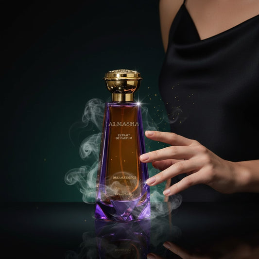 Almasha Dream Essence Extrait de Parfum, a 100ml bottle with a gradient amber and purple glass bottle and gold cap.